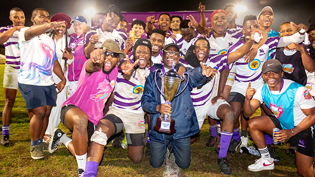 Rhodes University Vice-Chancellor, Professor Sizwe Mabizela, celebrates with the rugby team after the final whistle. Photo cred: Vusumzi Tshekema.